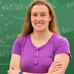 Professor Laura Boucheron standing in front of chalkboard