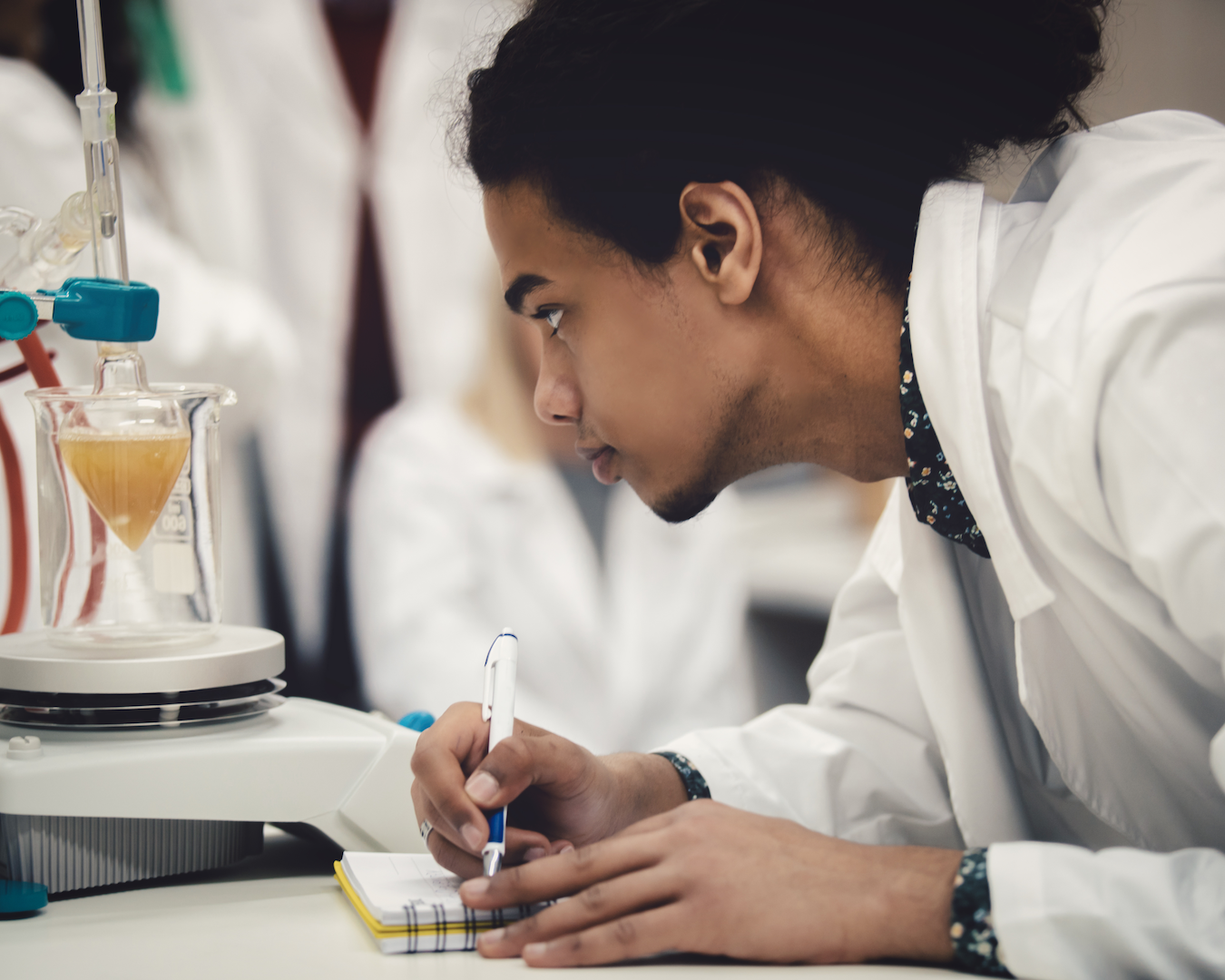 a student looking at a chemical in lab