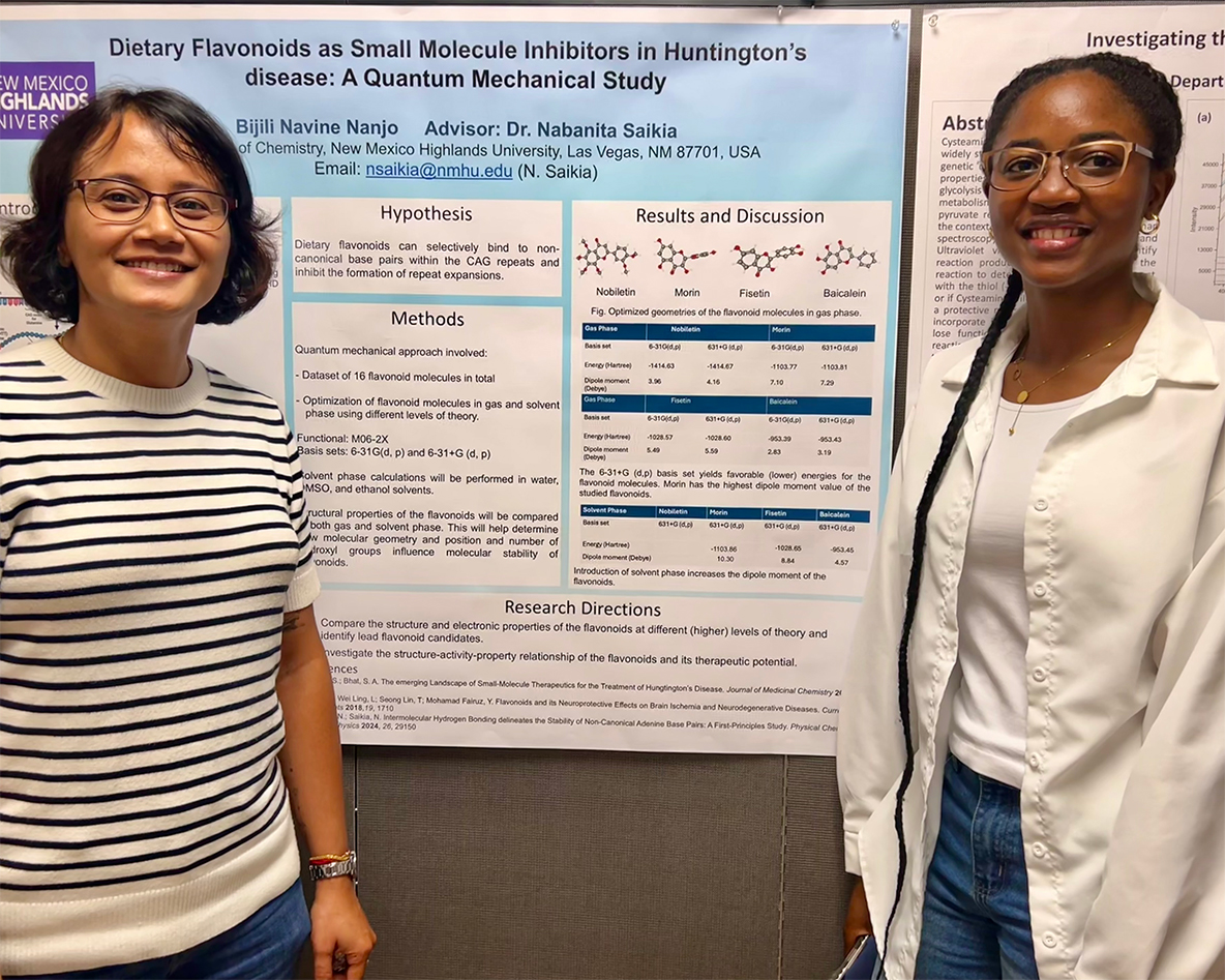 faculty and student researchers standing in front of poster