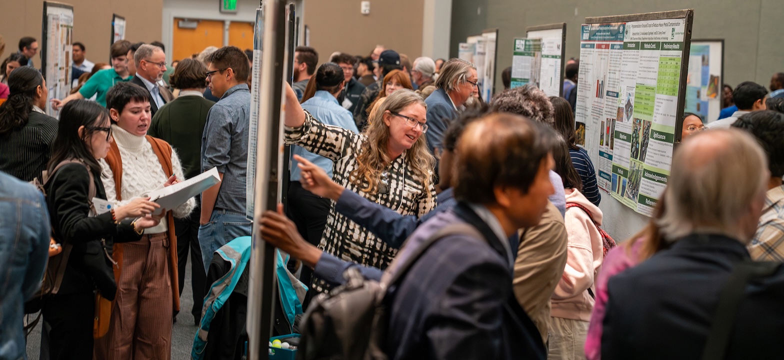 crowd of people viewing the poster session
