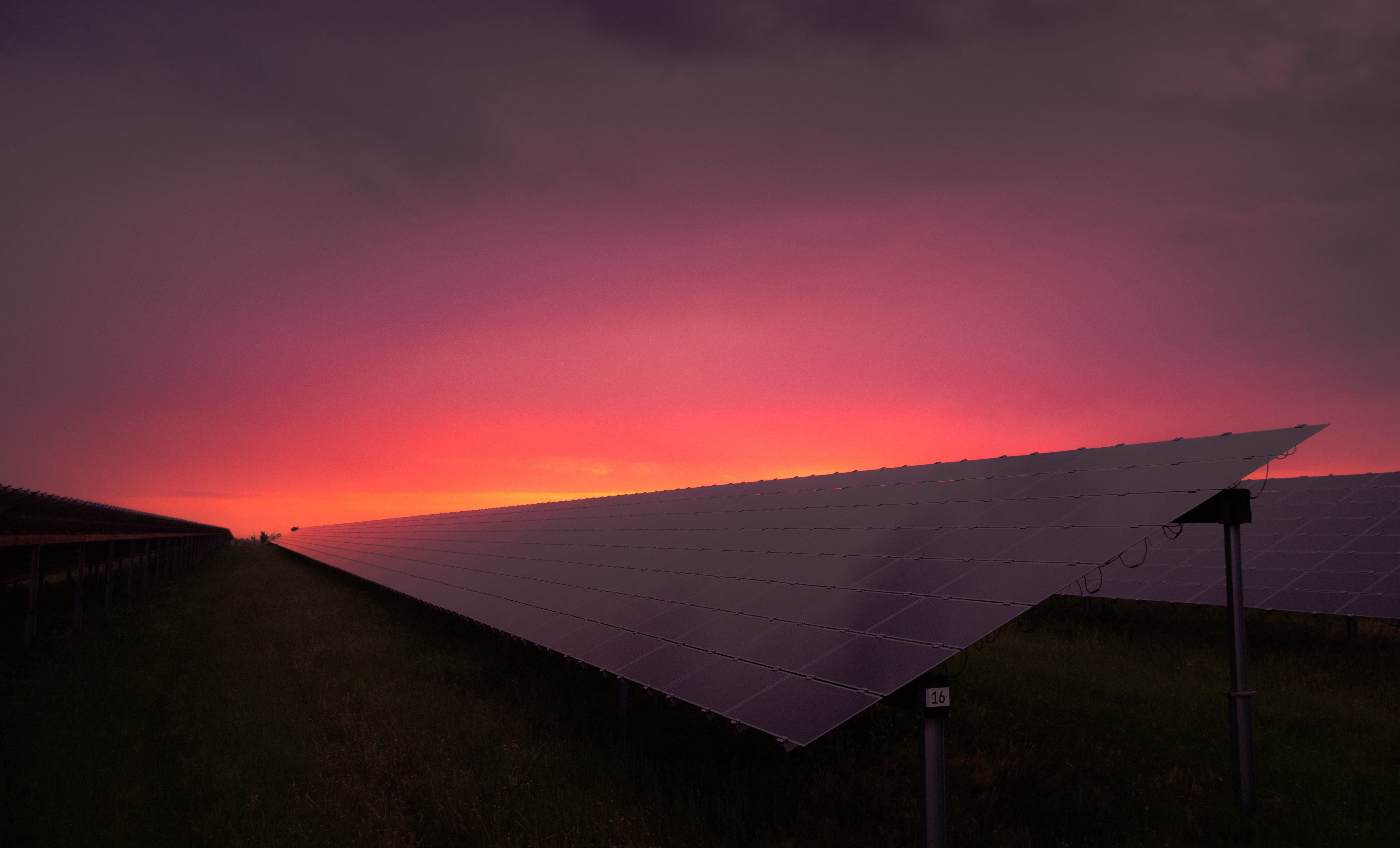 Picture of solar panels and red sunrise